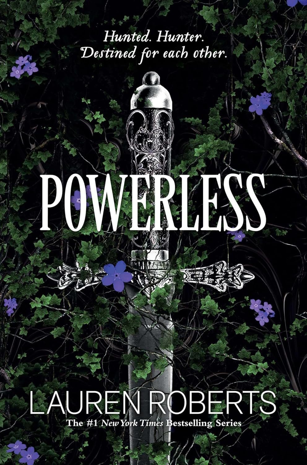 Sword entwined with green vines and purple flowers forms the backdrop for the book cover of 'Powerless' by Lauren Roberts, set against a dark background. The tagline reads: 'Hunted. Hunter. Destined for each other.'