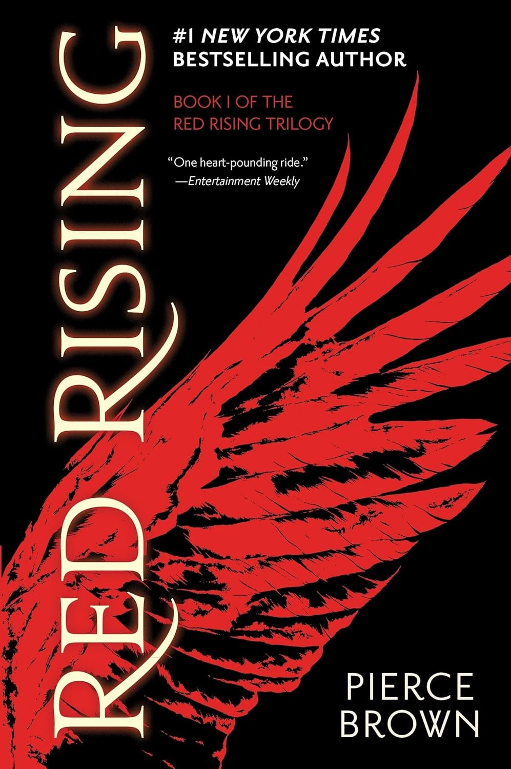 Black book cover titled 'Red Rising' by Pierce Brown, featuring a striking red wing. The design suggests intensity and power, with a bold, dynamic look.