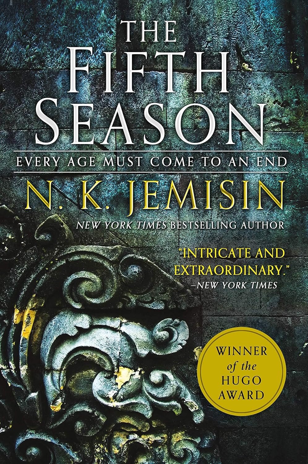 Book cover of 'The Fifth Season' by N.K. Jemisin, featuring ornate stone carvings and teal hues. Includes quote 'Intricate and extraordinary.' Winner of the Hugo Award.