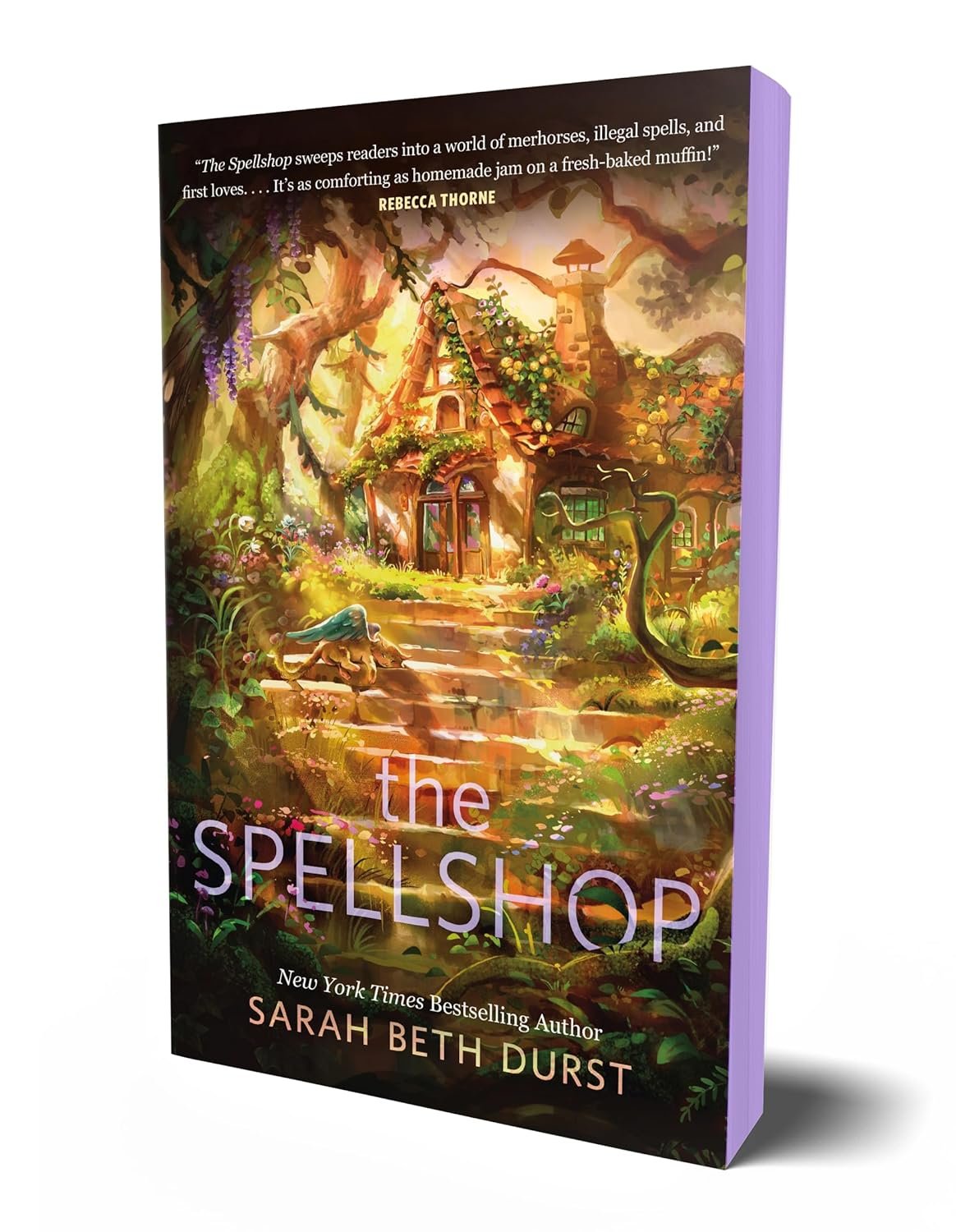 Colorful book cover for 'The Spellshop' by Sarah Beth Durst. Features a whimsical cottage nestled in a lush, enchanted forest.